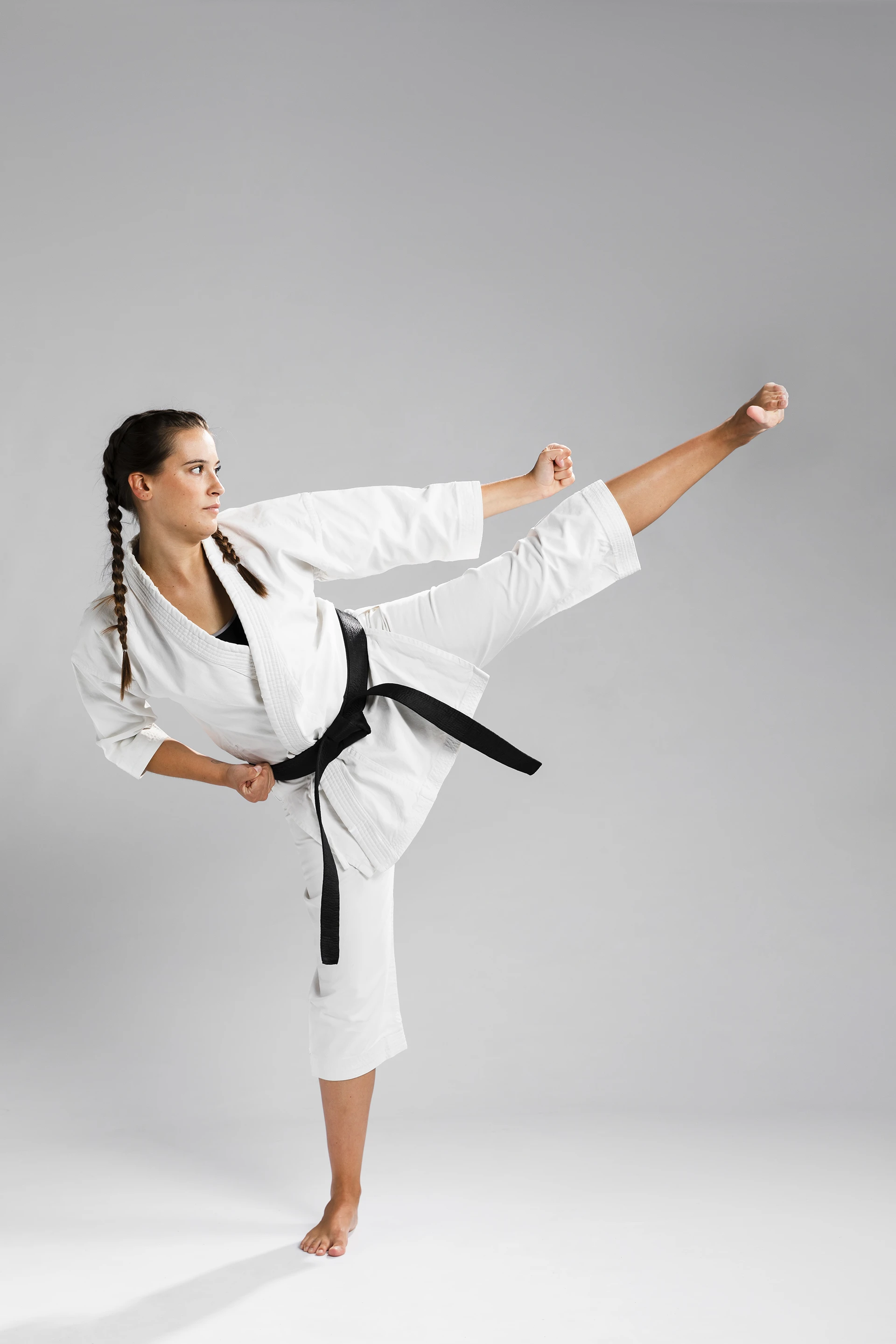 sideways karate woman traditional white kimono white background