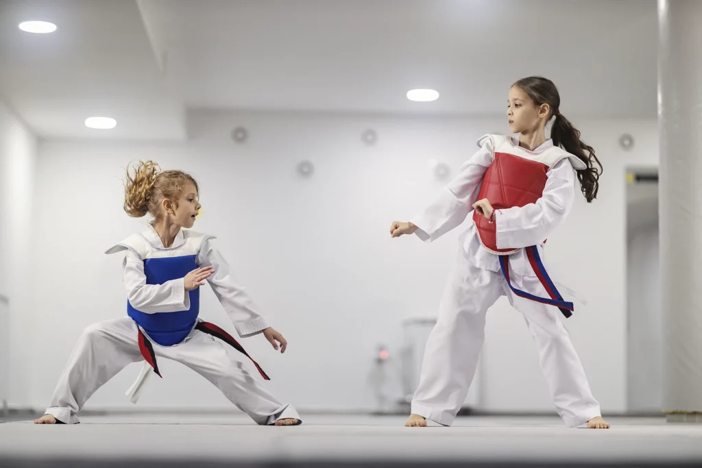 taekwondo kids doboks practicing combat martial art school