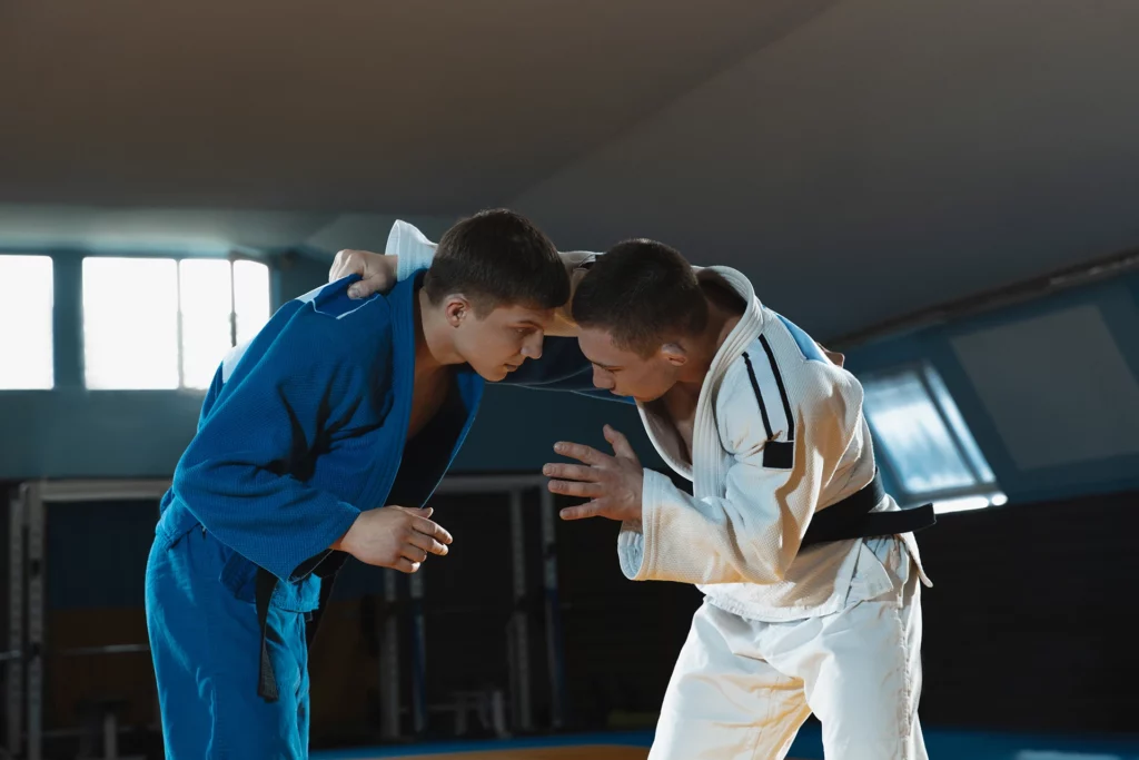 two young judo fighters kimono training martial arts gym